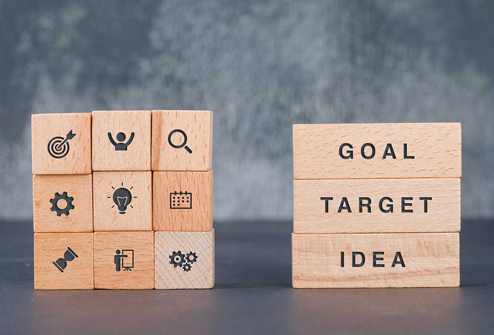 business-target-concept-with-wooden-blocks-with-icons-it-side-view